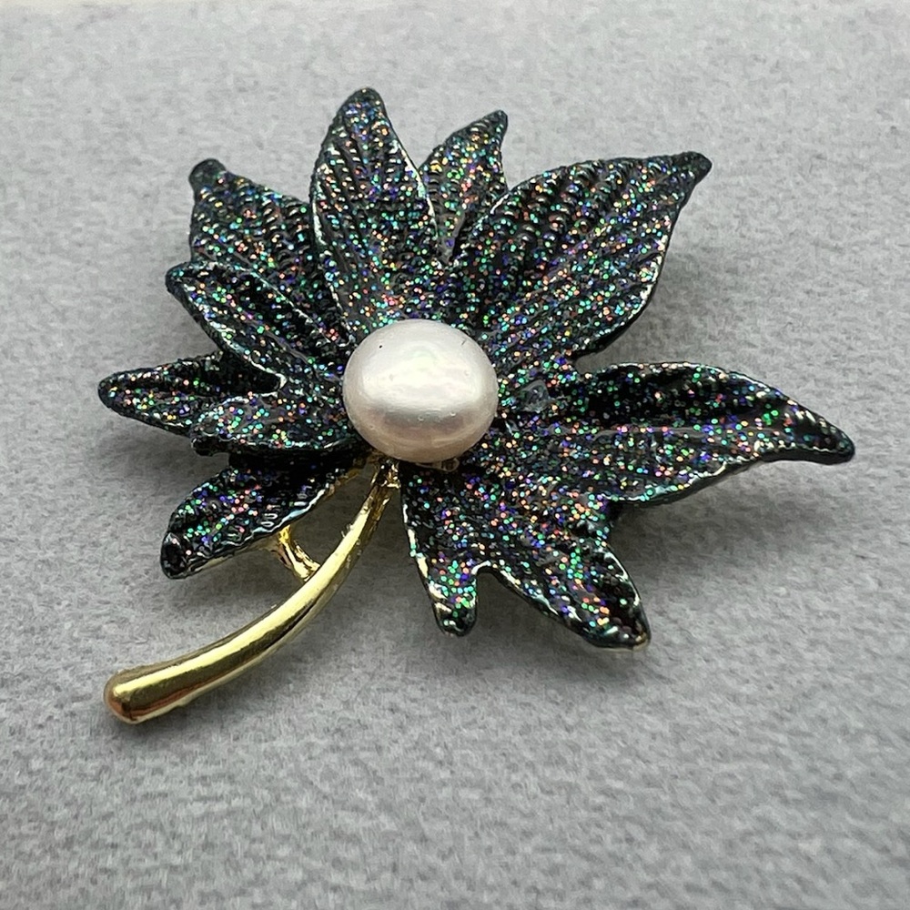 Elegant Black and Gold Leaf Brooch with Pearl